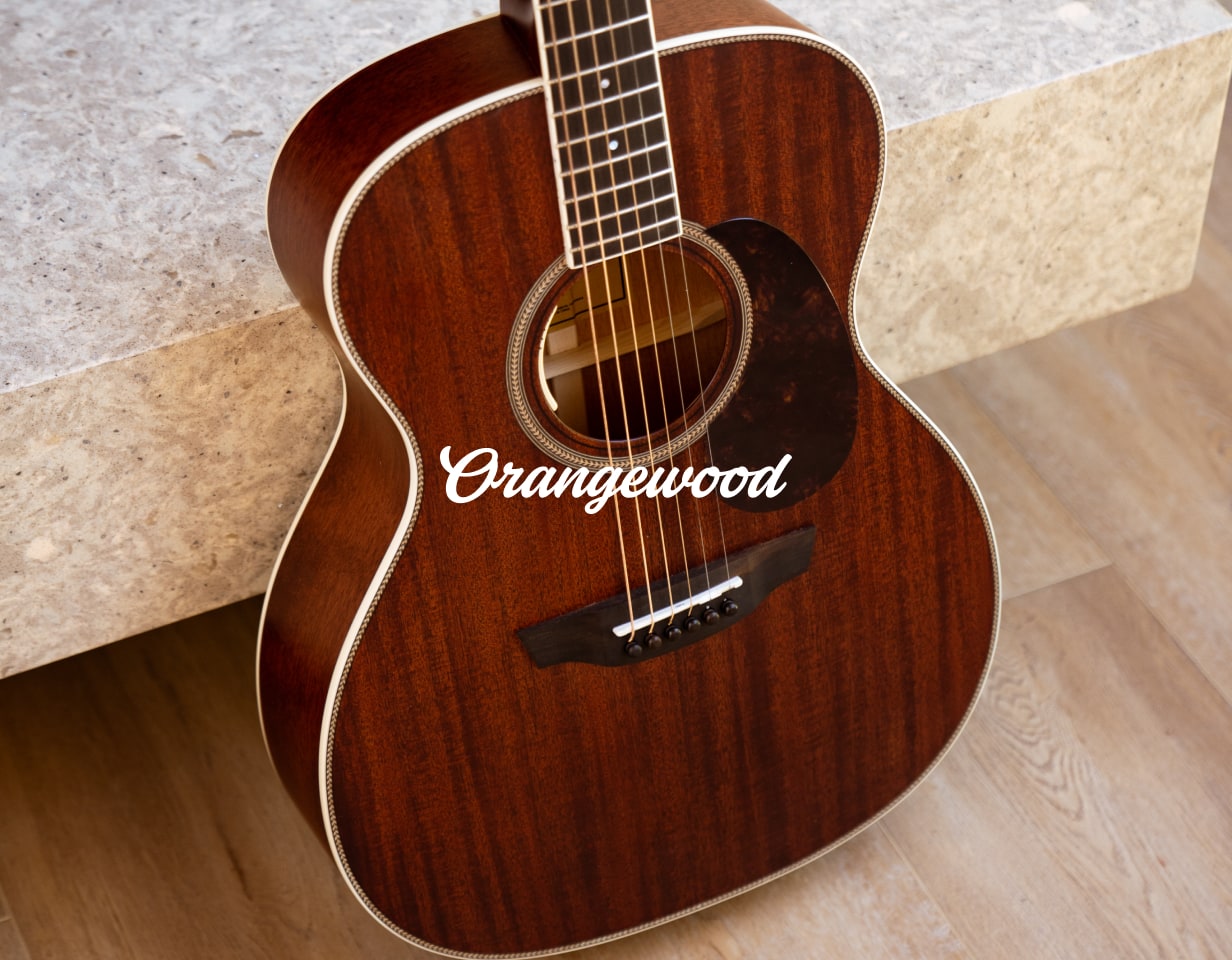 Mahogany acoustic guitar with Orangewood logo overlaid